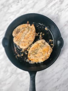 Cooked Garlic Butter Chicken iBreast in a Cast Iron Pan