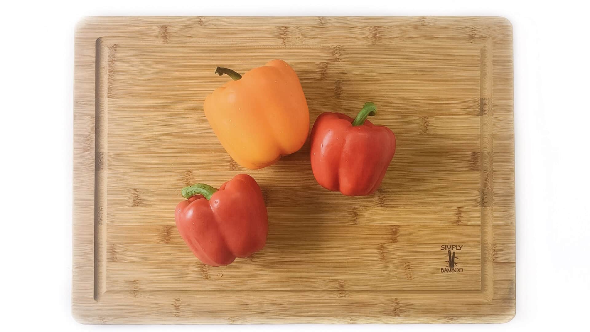Bell Peppers on a Wood Cutting Board