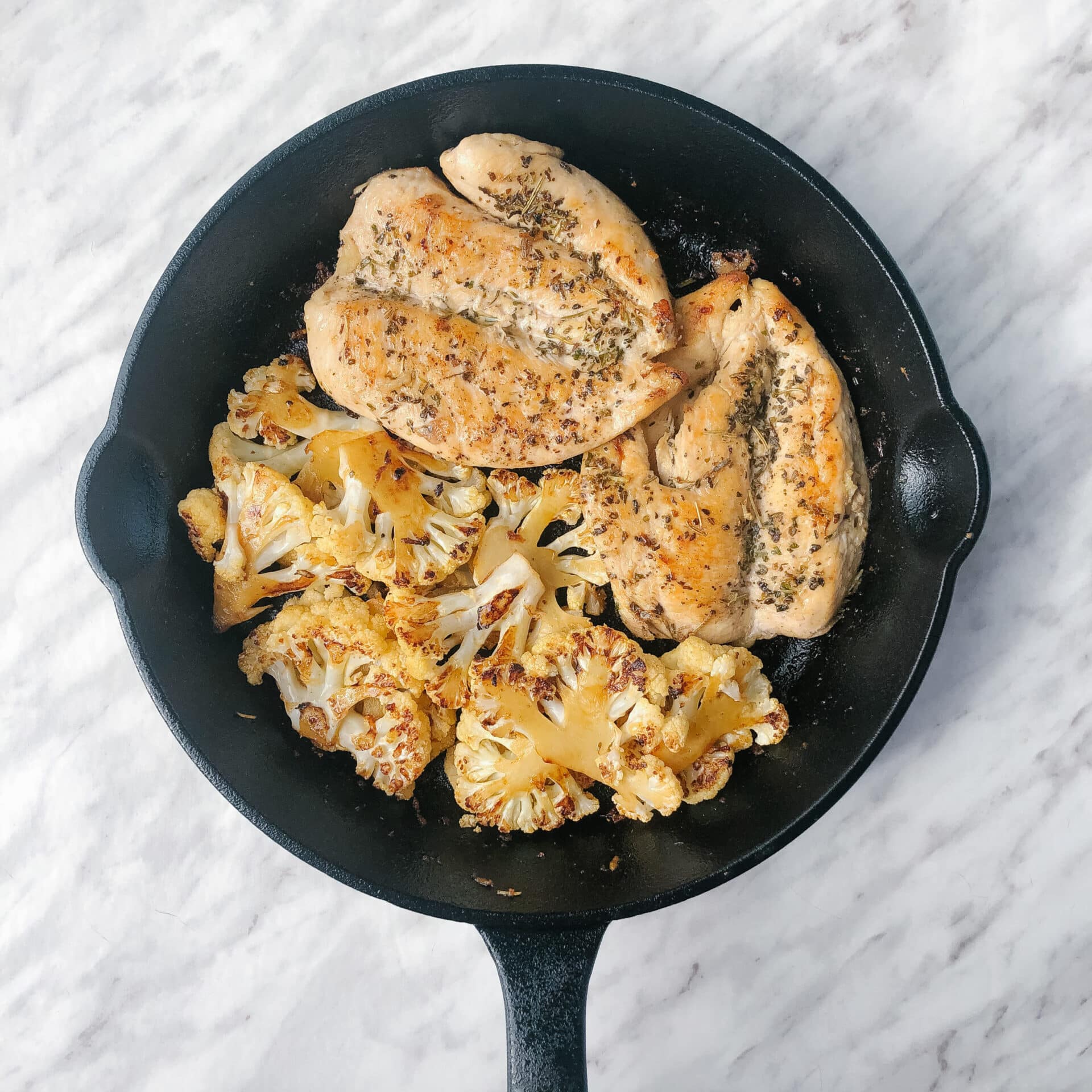 One-Pan Garlic Butter Chicken and Cauliflower Finished Recipe in a Cast Iron Pan