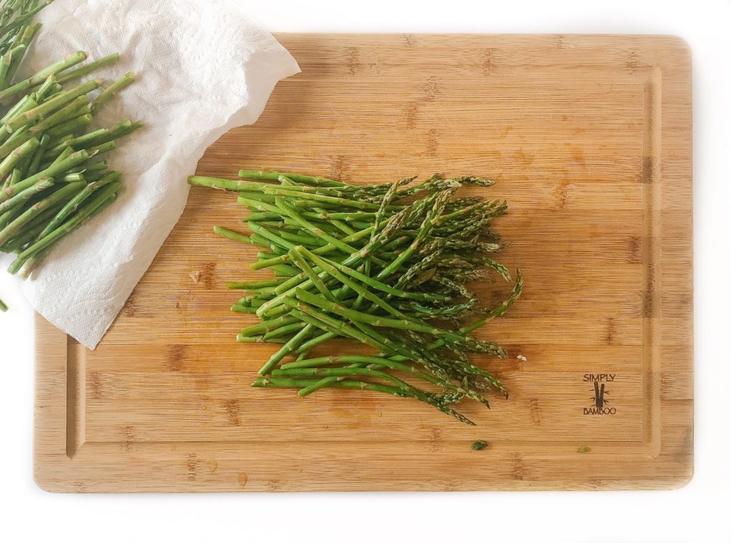 trimmed asparagus on a cutting board