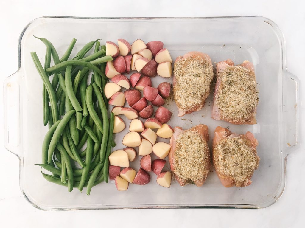 one-pan honey mustard chicken and veggies - ingredients in pan