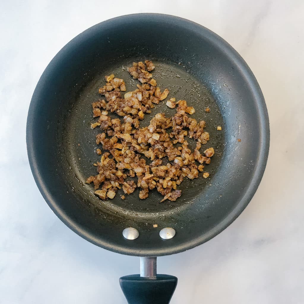 Caramelized onions in a pan with spices