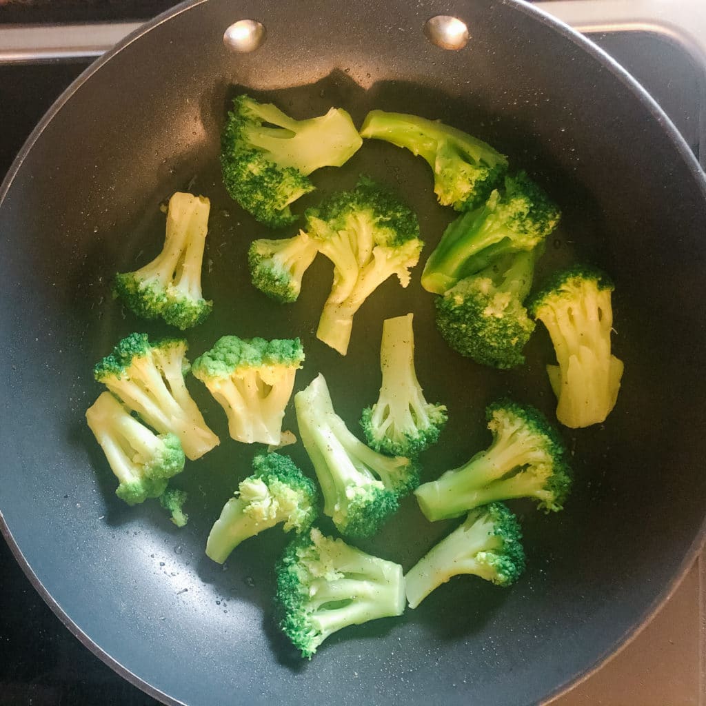 frozen broccoli in a pan 