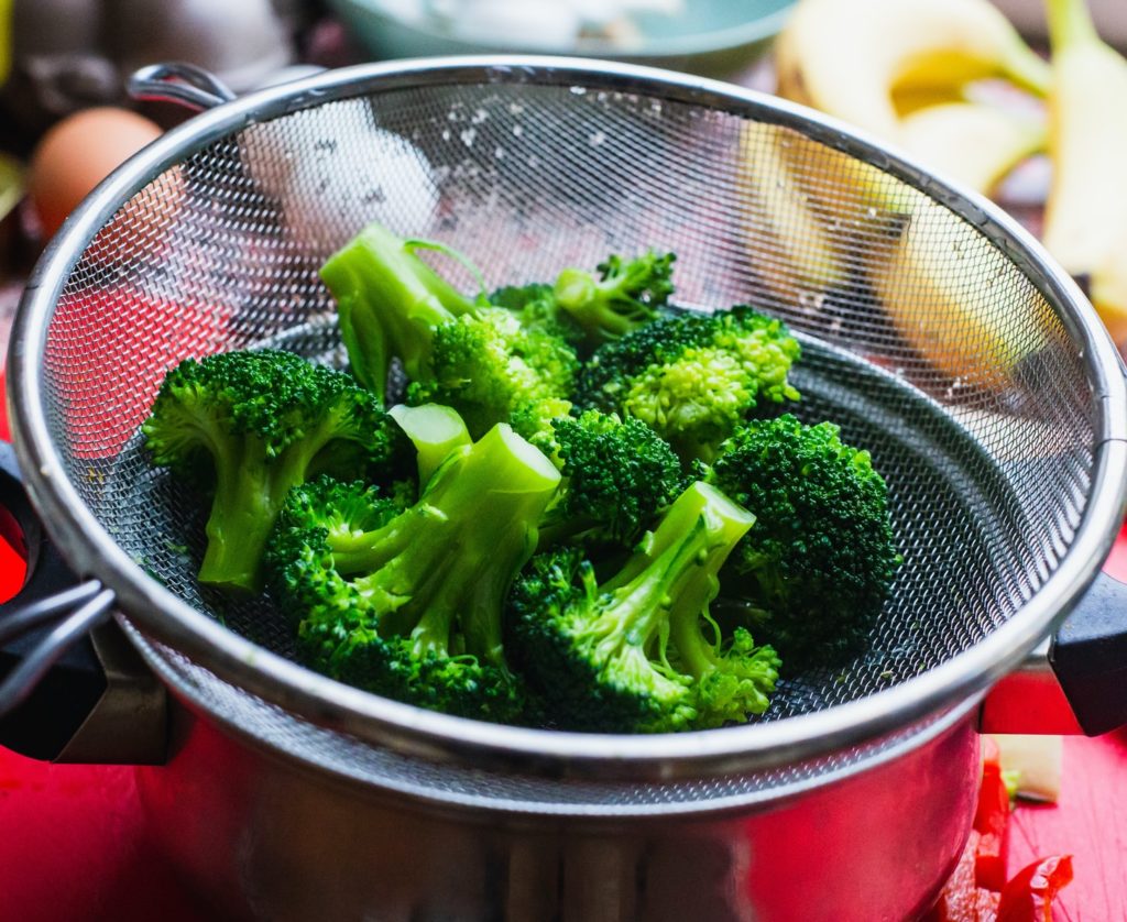 cooked broccoli in basket