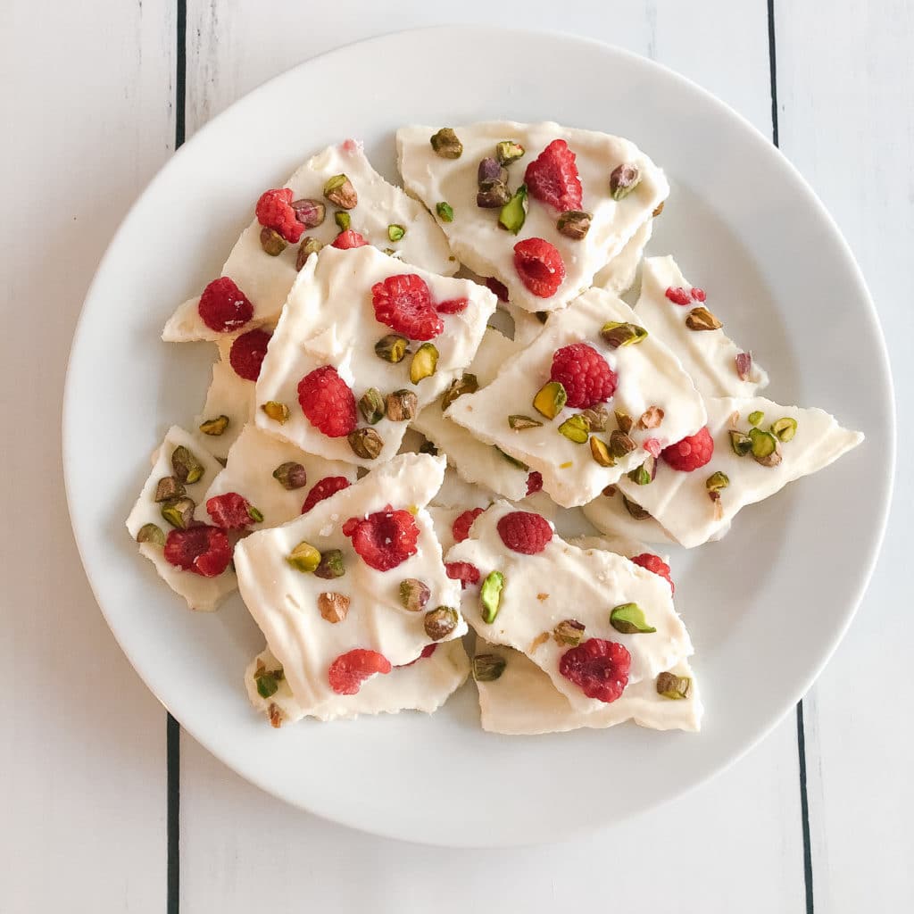 Festive raspberry pistachio vanilla frozen greek yogurt bark