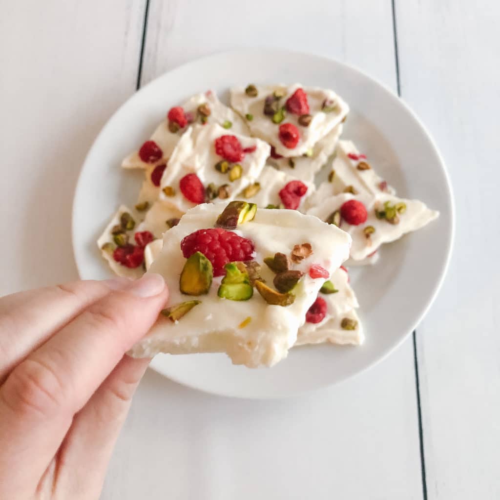 Festive raspberry pistachio vanilla frozen greek yogurt bark