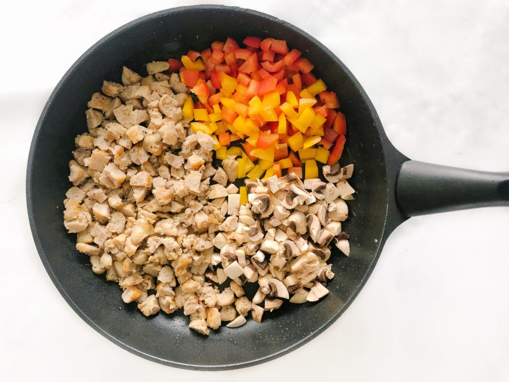 chicken sausage, peppers, mushrooms in a pan