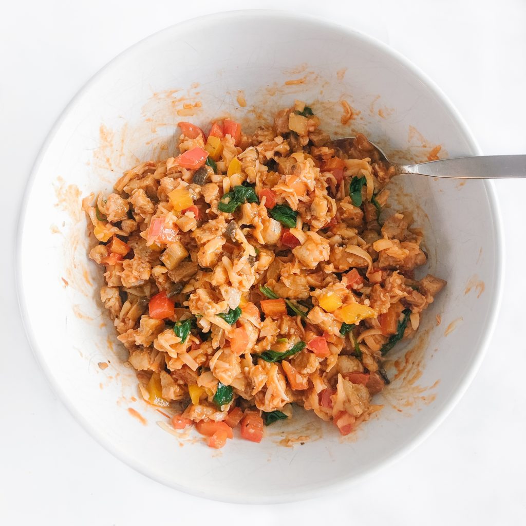 chicken sausage, peppers, mushroom, spinach, cheese, pizza sauce in a bowl